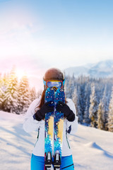 Reflection of the winter mountain landscape in a ski mask.