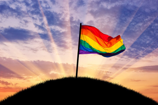 Rainbow flag on a hilltop