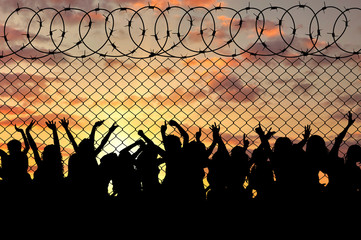 Silhouette of a crowd of refugees