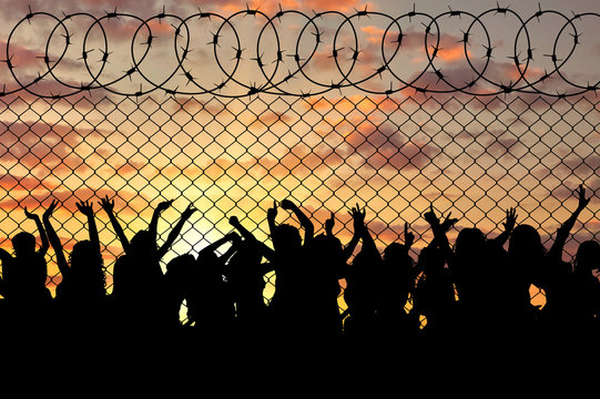 Silhouette of a crowd of refugees