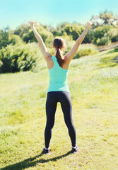 Obraz na płótnie Canvas Fitness happy runner woman enjoying after training in park, runn