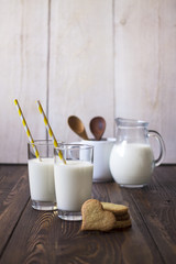 Milk and cookies for breakfast on a wooden background