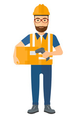 Worker checking barcode on box.