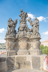 Fototapeta na wymiar Statues of Madonna with St. Dominic and St. Thomas Aquinas - Prague