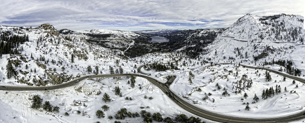 Donner Pass, near Truckee California. This is a 5 image aerial panoramic of the snow covered memorial bridge and pass.