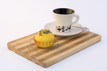 muffin served with cup of tea