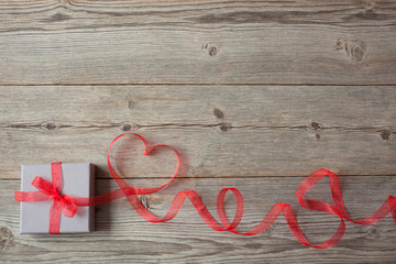 Gift box red ribbon and heart on Valentine's Day