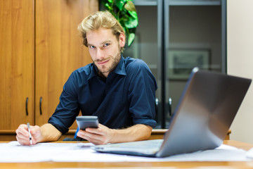 Portrait of a businessman using his mobile phone