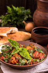 Chicken stewed with tomatoes and herbs