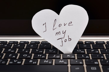 i love my job
cut paper heart with the inscription 
