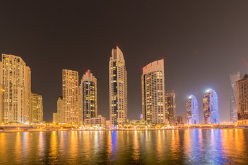 Obraz na płótnie Canvas Dubai - JANUARY 10, 2015: Marina district on January 10 in UAE, Dubai. Marina district is popular residential area in Dubai