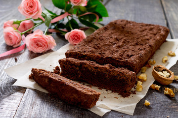 Chocolate cake with walnuts Brown and pink roses