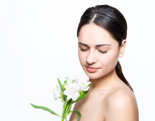 Fototapeta premium pretty girl holding a flower and relaxes