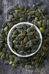 pumpkin seeds on wooden surface