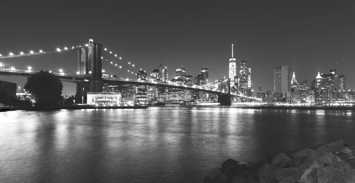 Black and white picture of New York at night.