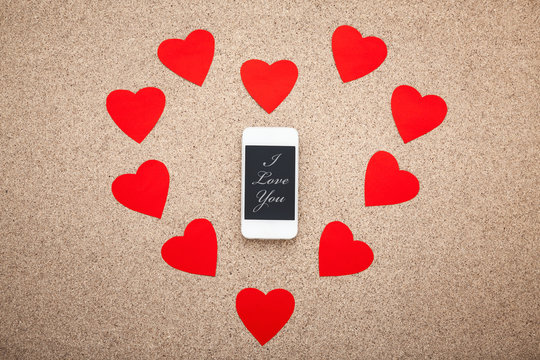 Texting love messages, Smartphone in the heart.