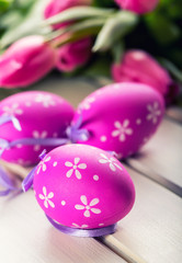 Happy easter. Multicolored spring tulips and Easter eggs. Spring and Easter decorations.