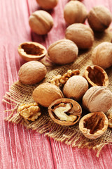 Walnuts on a red wooden table