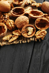 Walnuts on a black wooden table