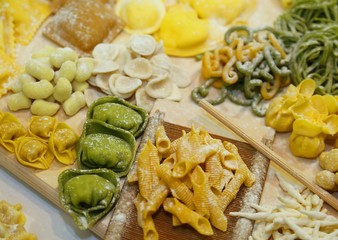 green and yellow tortellini with eggs and flour and spinach