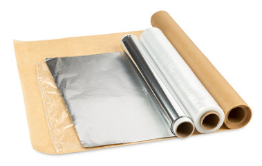 roll of aluminum foil greaseproof paper and cling foil isolated on white background