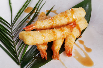shrimp tempura sauce royal tropical leaves white background close-up menu