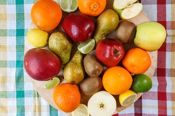 Fresh fruit on colored kitchen towel