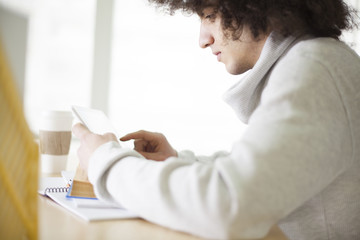 Young man using digital tablet