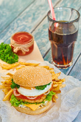 Home made burger on wooden background