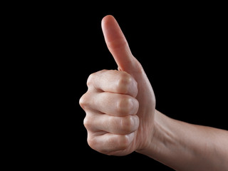 Approval thumbs up like sign as caucasian hand gesture isolated over black