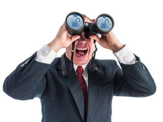 Fototapeta na wymiar Photograph of a man dressed in business attire shrieking as he looks through binoculars. Reflected in the lenses of the binoculars is a cloud with an unlocked padlock.