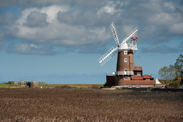 Clouds gather over Cley Towermill windmill, Cley next the Sea, Norfolk