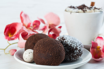 Cakes with coffee and chocolate and coconut flakes