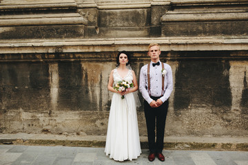 The bride and groom posing 