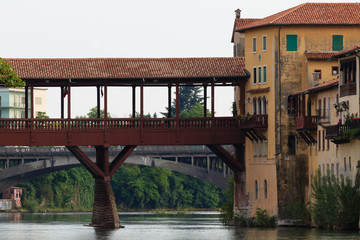 Fototapeta na wymiar Panorama from Bassano del Grappa, old wooden bridge over Brenta river, italian landscape