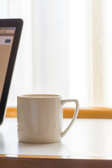 White coffee cup in coffee shop