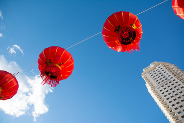 Red Chinese Paper Lanterns against a Blue Sky