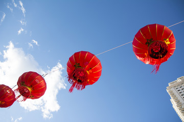 Red Chinese Paper Lanterns against a Blue Sky