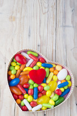 Colorful jelly beans in the shape of a heart
