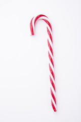 Mint hard candy cane striped in Christmas colours isolated on a