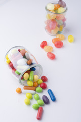 Multicolor candies in glass jars