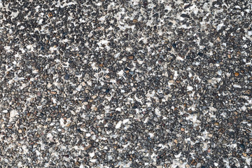 White walls with  pebbles and black stains