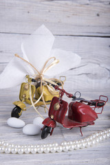 Scooter toys wedding favor christening on old wooden table