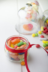 Multicolor candies in glass jars