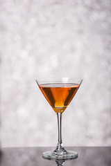 Evening drink. glasses with red liqueur on bokeh background