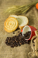 Coffee and bread on cloth background