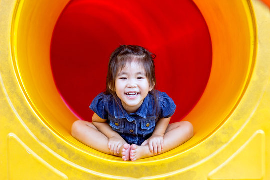 happy asian girl play colour in playground with good emotion kids