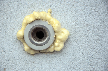 polyurethane foam filled pipe in the wall