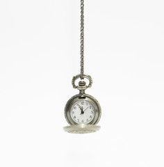 old vintage pocket watch isolated on a white background