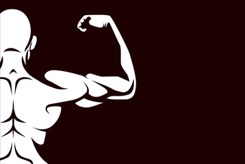 Healthy man taking off his shirt to flex his back muscles on dark background